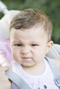 Close-up of angry baby girl looking at camera Royalty Free Stock Photo