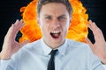 Close-up of angry businessman shouting against fire Royalty Free Stock Photo