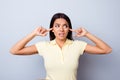 Close up of annnoyed young latinamerican girl, closing her ears Royalty Free Stock Photo