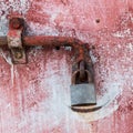 Close up of an antique grunge door painted in red