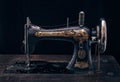 Close up of antique sewing machine Singer on black background.