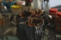 Close-up of antique tea making equipment.
