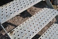 Close-up of antislip steps of perforated metal plates