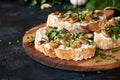 Close-up of appetizing bruschetta cream cheese and fried champignon mushrooms