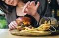 Close-up, appetizing burger and french fries in a cafe. Royalty Free Stock Photo