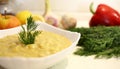 Close-up appetizing lentil porridge in a white dish on a light kitchen countertop. Top down. Healthy eating concept. Royalty Free Stock Photo