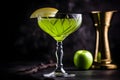 Close up of apple martini cocktail with apple slice garnish on dark background. Appletini cocktail with apples slices, vodka, Royalty Free Stock Photo