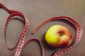 Close up apple, meter tape. Concept Healthy way of life