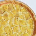 Close up of a apple pie on a white plate.