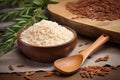 close-up of arborio rice and wooden spoon on rustic table Royalty Free Stock Photo