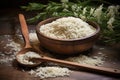 close-up of arborio rice and wooden spoon on rustic table Royalty Free Stock Photo