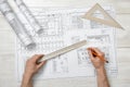 Close-up of architect hands holding centimeter ruler and pencil. Royalty Free Stock Photo