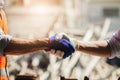 Close-up Architects shaking hands with construction workers after a successful background meeting on a construction site. Work as Royalty Free Stock Photo