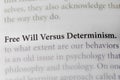 close-up of the argument of Free Will Versus Determinism, on paper background