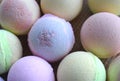 Close up aromatherapy spa bombs on desk. Many colored bath balls for beauty, skincare or relax.