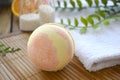 Close up aromatherapy spa design with bath bomb and towel on wooden background. Royalty Free Stock Photo