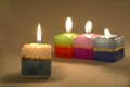 Close-up of an arrangement of burning candles .