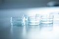 Close up of an array of clear glass petri plates in a laboratory