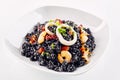 Close up of Arroz Negro in white dish