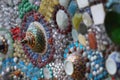 Close-up art design of the colorful broken tile, bead, bowl lid and stone decorating