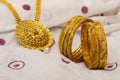 Close-up of artificial golden bangles and necklace Royalty Free Stock Photo