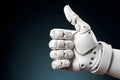 Close up of artificial intelligence robotic hand showing thumbs up sign in front of dark background