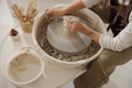 Close up of artisan& x27;s hands shaping clay bowl in pottery studio. Pottery art and creativity Royalty Free Stock Photo