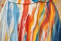 close up of artists paint-streaked apron