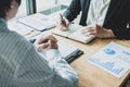 Close-up. Asian business of hand holding pen reviewing and signing,Home buying contract, Royalty Free Stock Photo