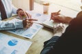 Close-up. Asian business of hand holding pen reviewing and signing,Home buying contract,Selective focus Royalty Free Stock Photo