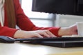 Close up on asian businesswomen hands typing Keyboard with a cup of coffee on computer desk in office Royalty Free Stock Photo