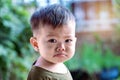 Close up of Asian child boy`s face with tears. Upset crying and mad little toddler boy.