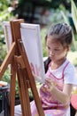 Close up of Asian child girl is painting on the canvas. Royalty Free Stock Photo