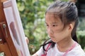 Close up of Asian child girl is painting on canvas. Royalty Free Stock Photo