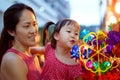 Close-up of Asian chinese mother and daughter shopping in china town during festive seasons
