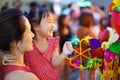 Close-up of Asian chinese mother and daughter shopping in china town during festive seasons