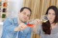 Close up asian couple clinking glasses in wine shop Royalty Free Stock Photo