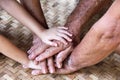 Asian family hands , little child girl, grandmother and grandfather teamwork concept