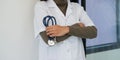 close up of asian female doctor standing arms crossed with stethoscope. Medical and Healthcare concept Royalty Free Stock Photo