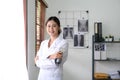 close up of asian female doctor standing arms crossed with stethoscope. Medical and Healthcare concept Royalty Free Stock Photo