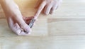 Close up of Asian female hands cutting fingernails. Young woman clipping her nails Royalty Free Stock Photo