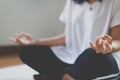 Close up of asian hands woman practices yoga and meditation in the lotus position