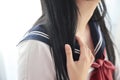 Close up of Asian High School Girl student neck in white room Royalty Free Stock Photo