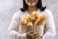 Close up Asian housewife woman hold grocery bread bag