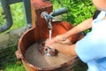 Close-up asian little child girl washing hands in water sinks