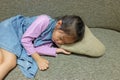 Close-up Asian little girl sleeping on gray sofa Royalty Free Stock Photo