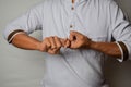 Close up Asian man shows hand gestures it means Friend isolated on white background. American sign language