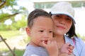 Close up Asian mother carrying her son with sucking finger in mouth Royalty Free Stock Photo