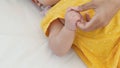 Close up of asian mother holding her newborn baby`s hand on the bed Royalty Free Stock Photo