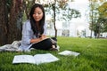 Close-up of asian pretty student studying, while sitting under t Royalty Free Stock Photo